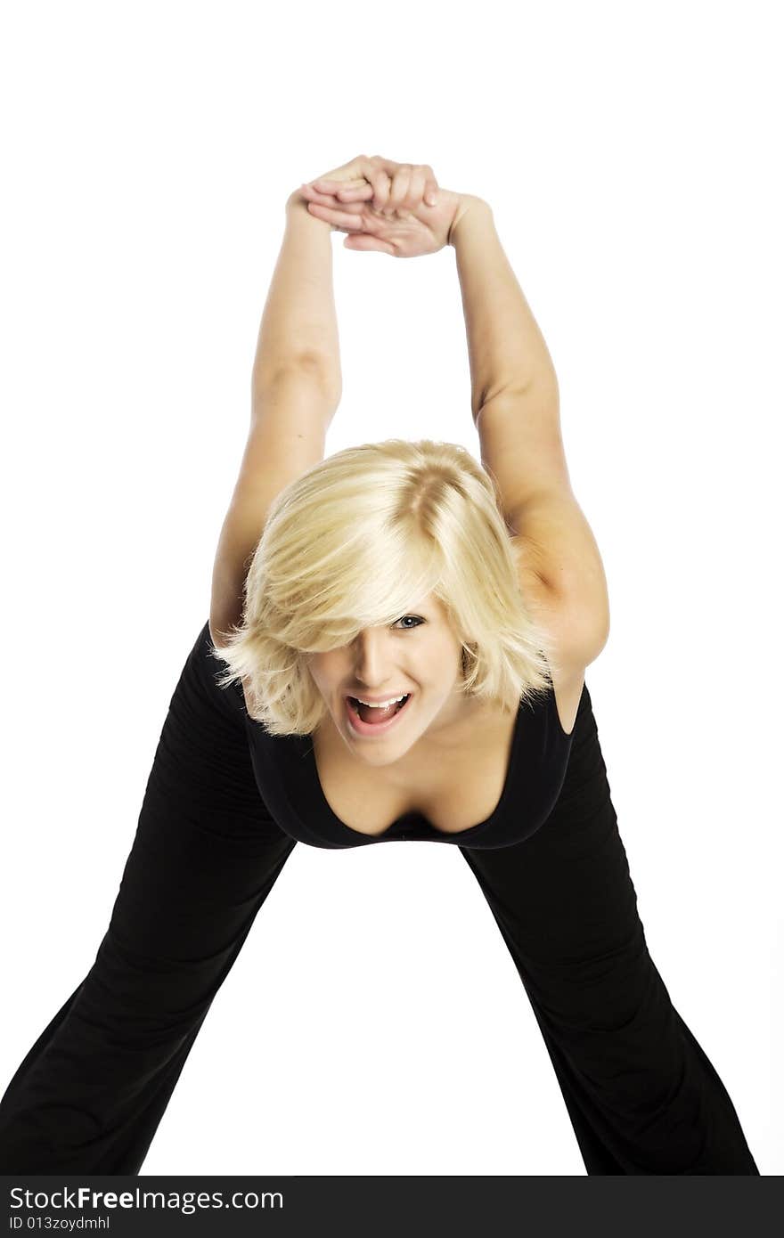 Young attractive blond Caucasian woman in black working out on white background. Young attractive blond Caucasian woman in black working out on white background.