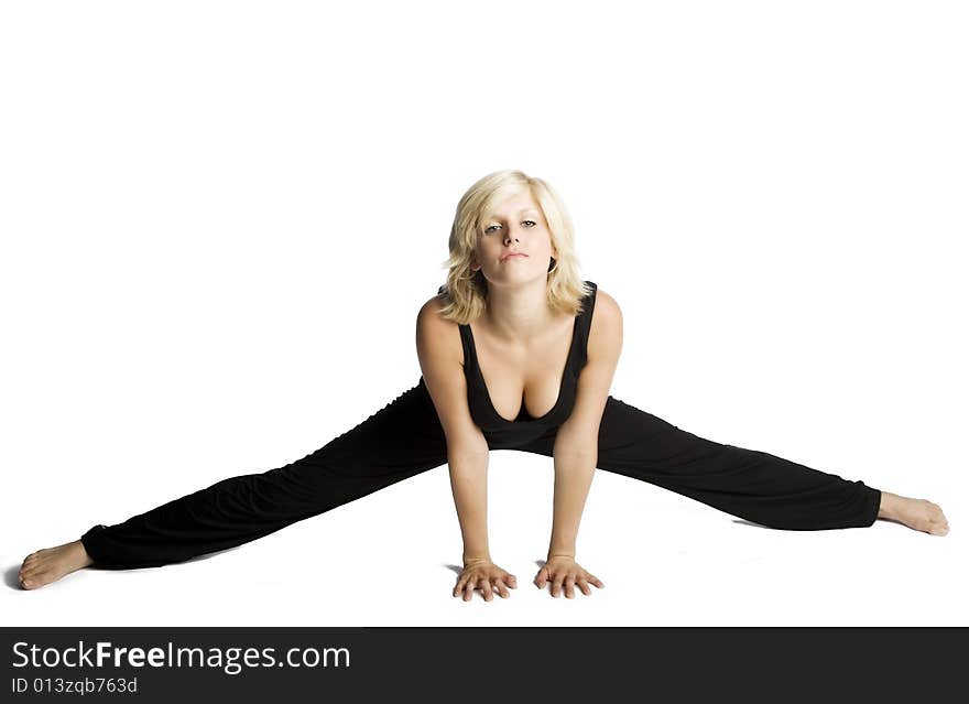 Young attractive blond Caucasian woman in black working out on white background. Young attractive blond Caucasian woman in black working out on white background.