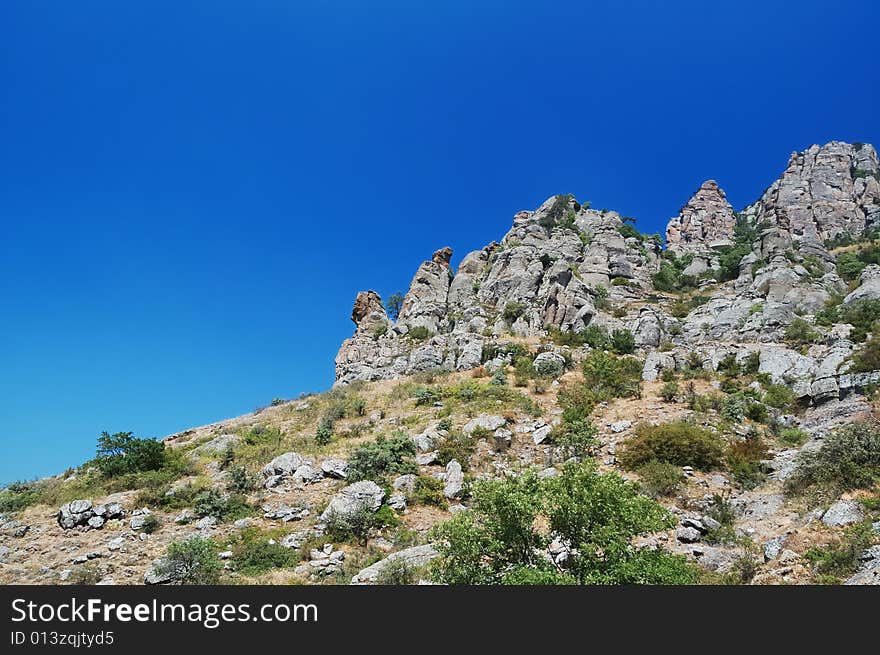 Mountains on a  blue sky background