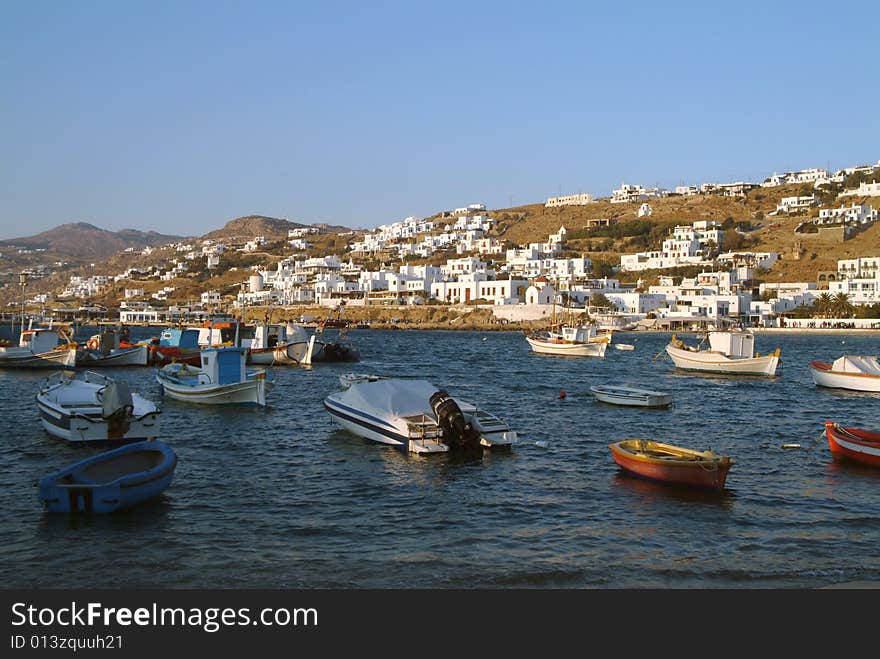 Mikonos skyline and harbor on blue sky day