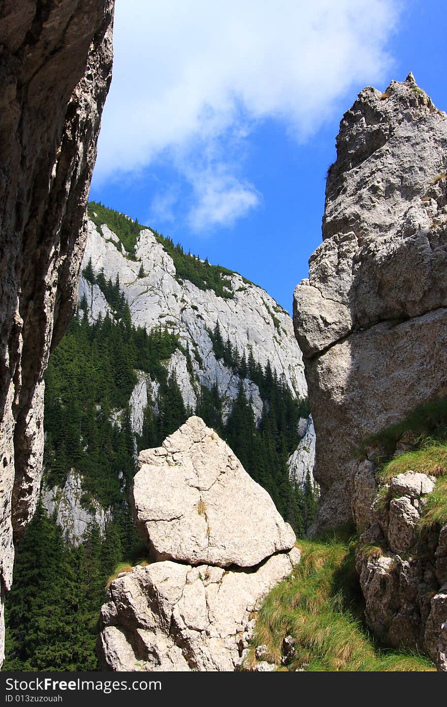 View from a cliff to the mountain ridge in the Romanian Carpathians. View from a cliff to the mountain ridge in the Romanian Carpathians.