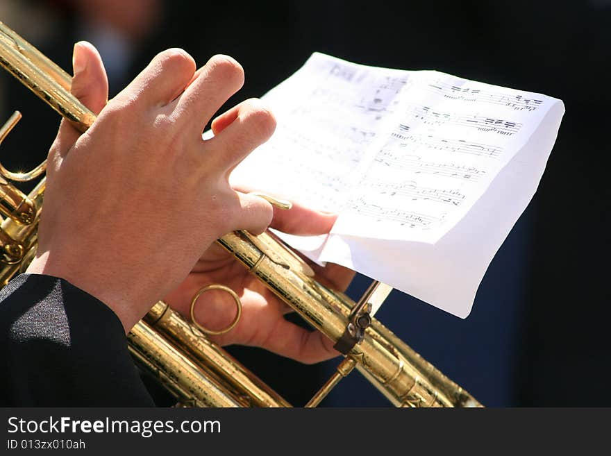 Hands of a trumpet player palying some tunes. Hands of a trumpet player palying some tunes