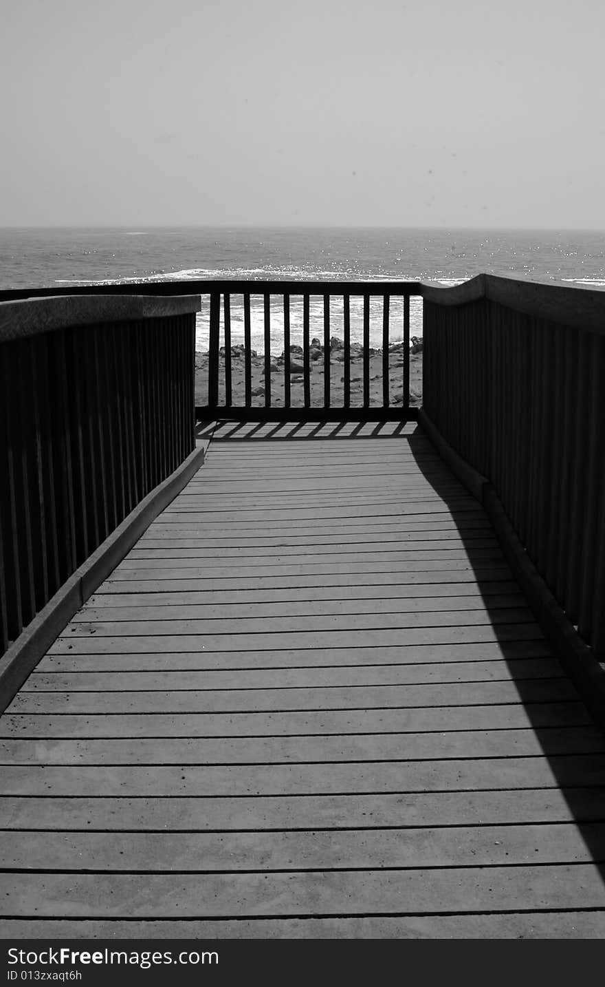 Pier to the ocean at the scheleton coast. Pier to the ocean at the scheleton coast