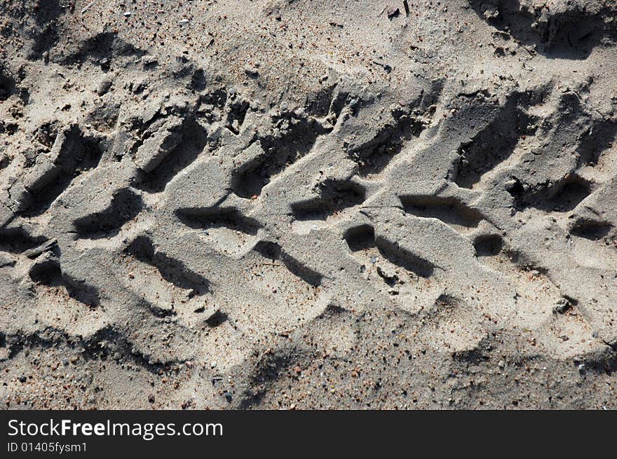 Track from a protector on sand. Track from a protector on sand