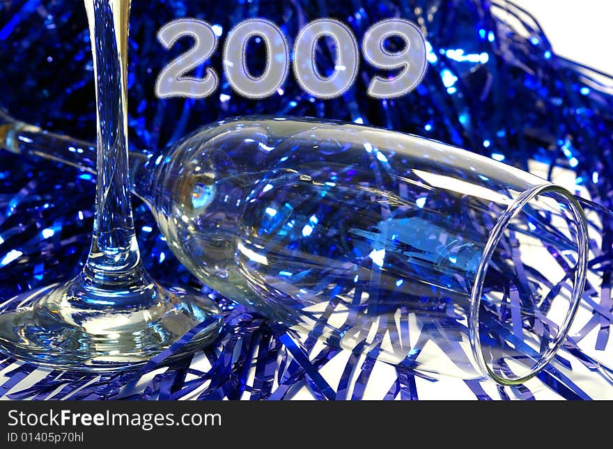 Champagne Goblet And A Dark Blue Tinsel