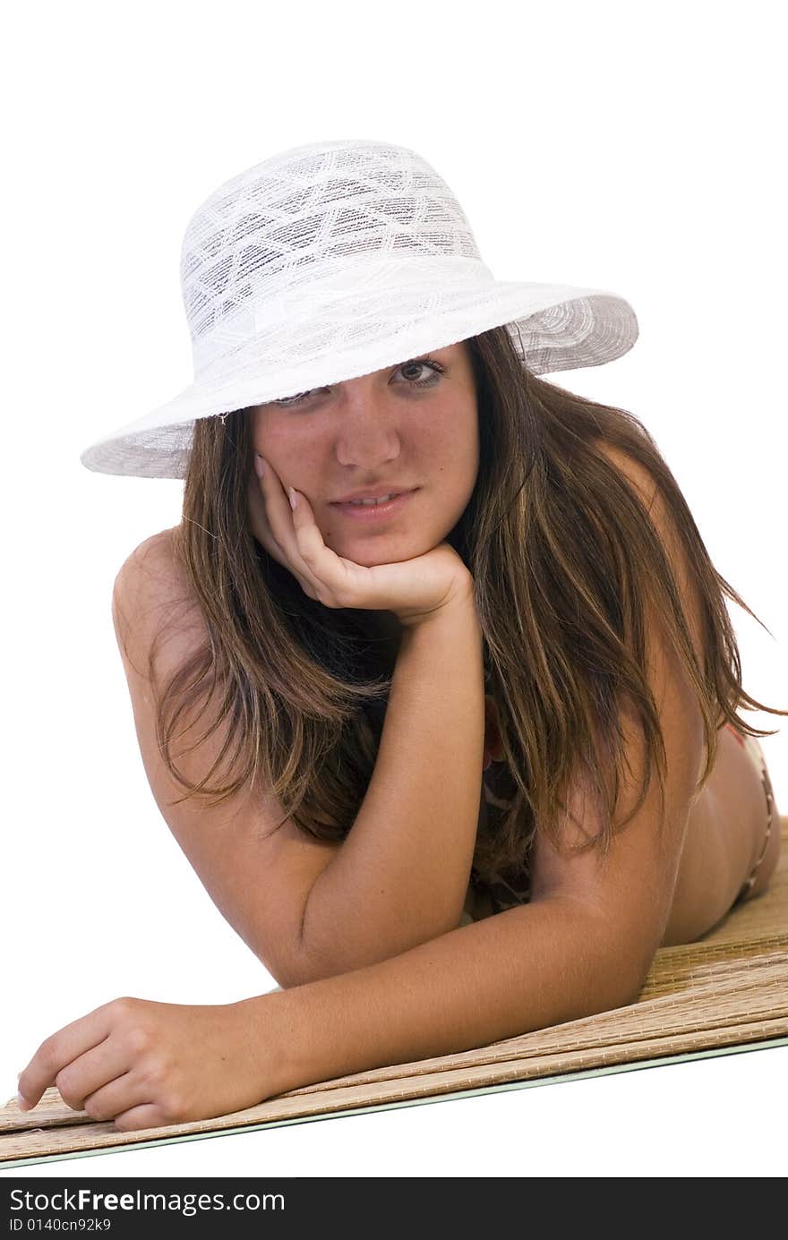 Girl with white hat posing on the floor