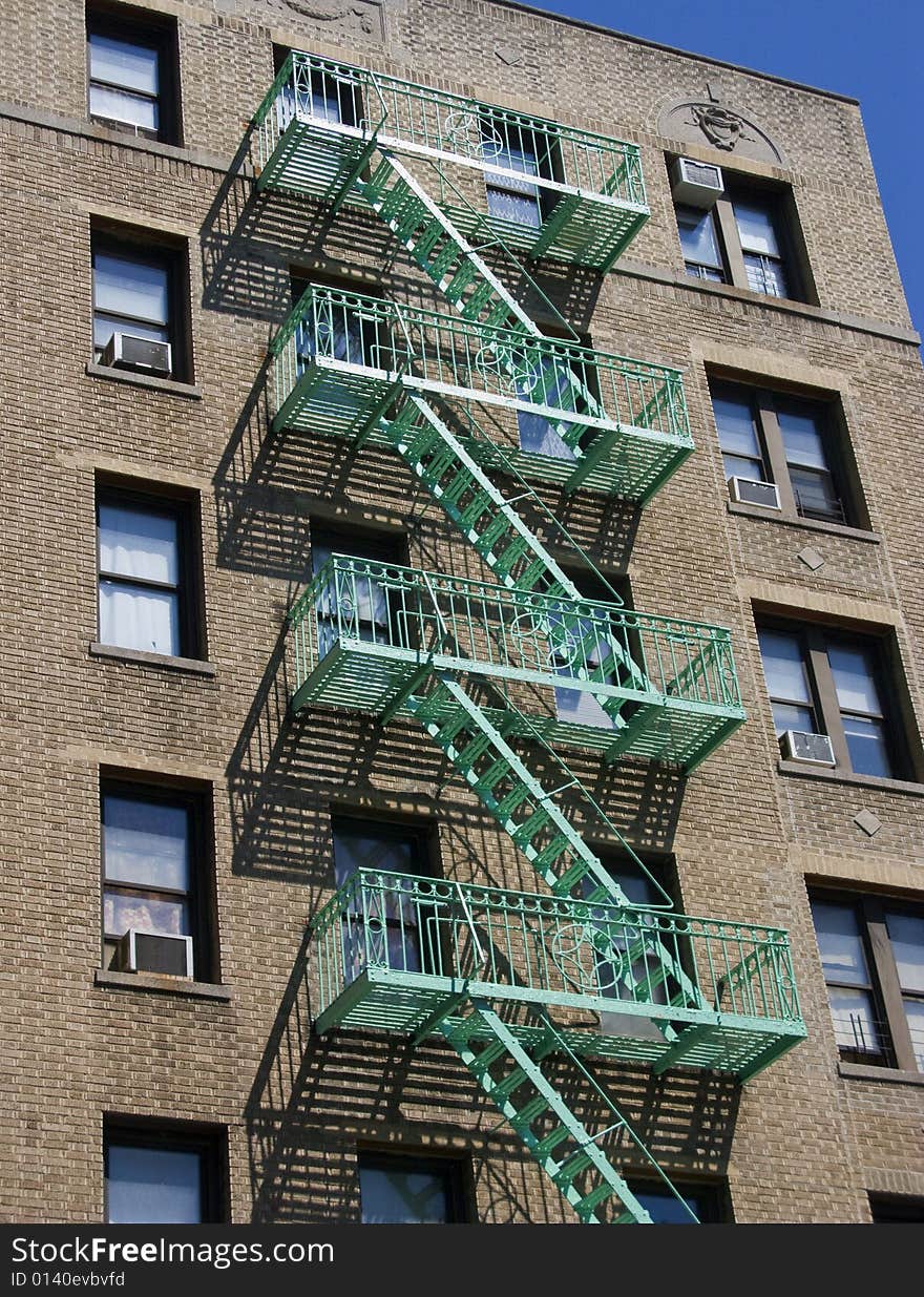 View looking up at fire escape on residential building. View looking up at fire escape on residential building