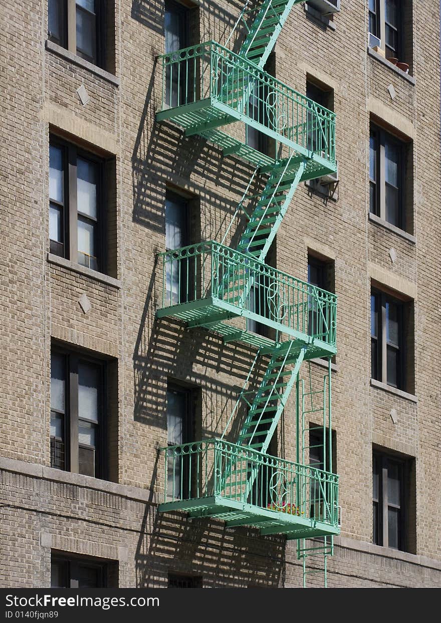 View from across street at fire escape on residential building. View from across street at fire escape on residential building