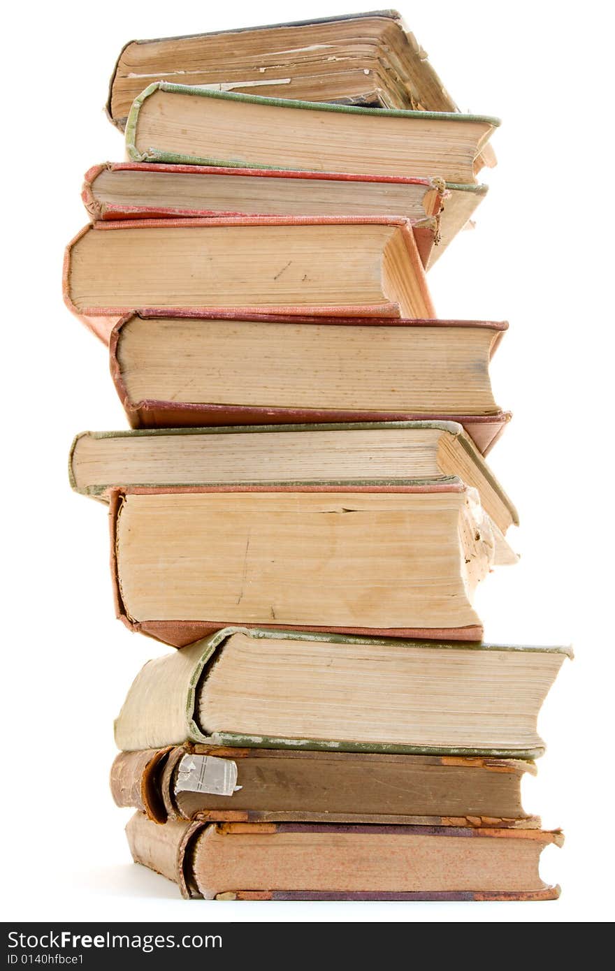 A pile of antique books on a white background