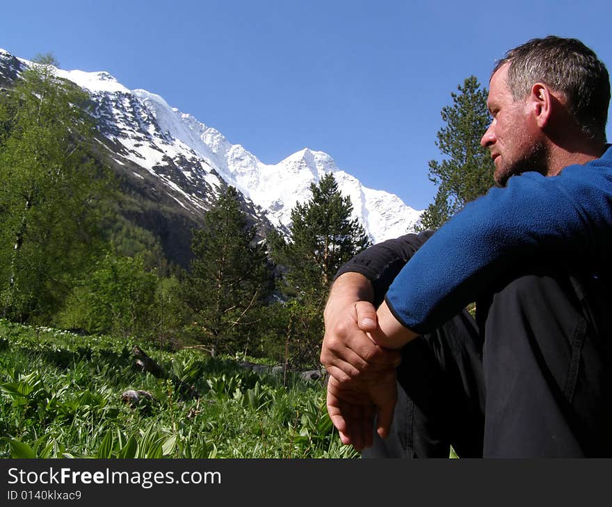 Man looks at the mountains