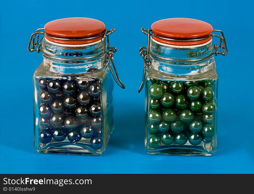 Two glass jars with red lids