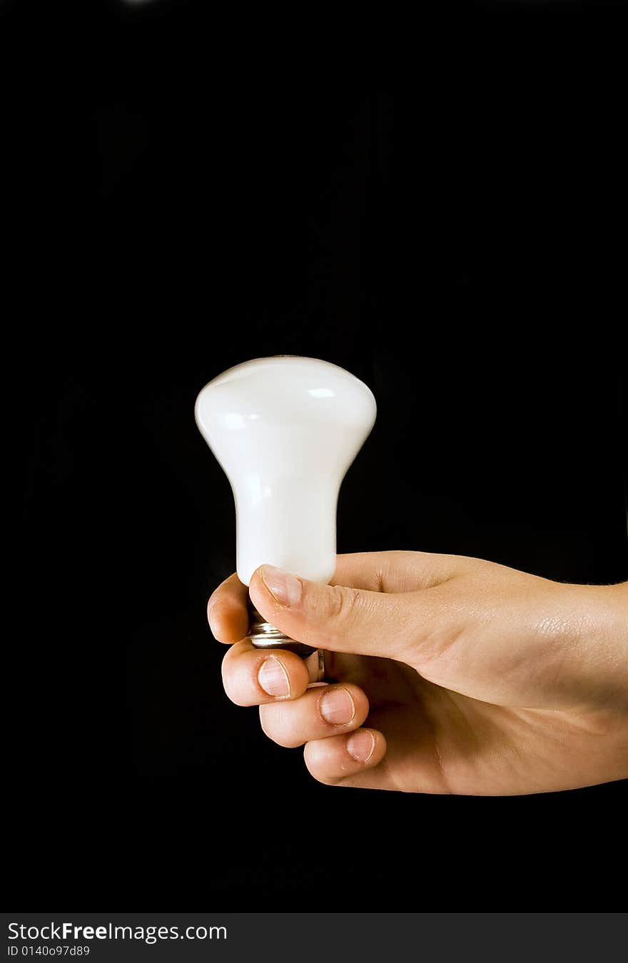 Hand holding white light bulb. Hand holding white light bulb