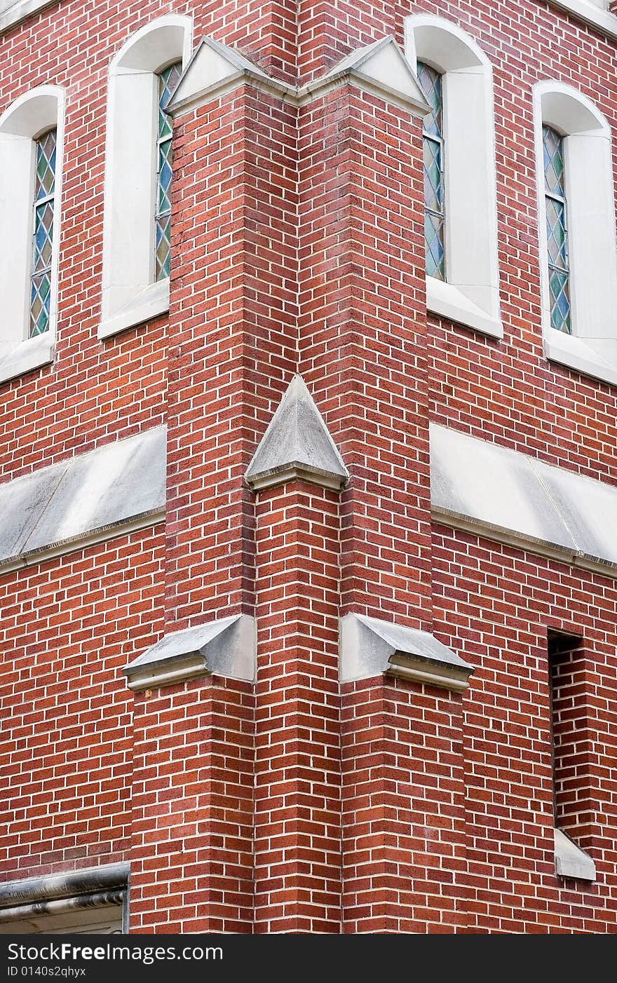 Corner detail of a brick church with windows. Corner detail of a brick church with windows