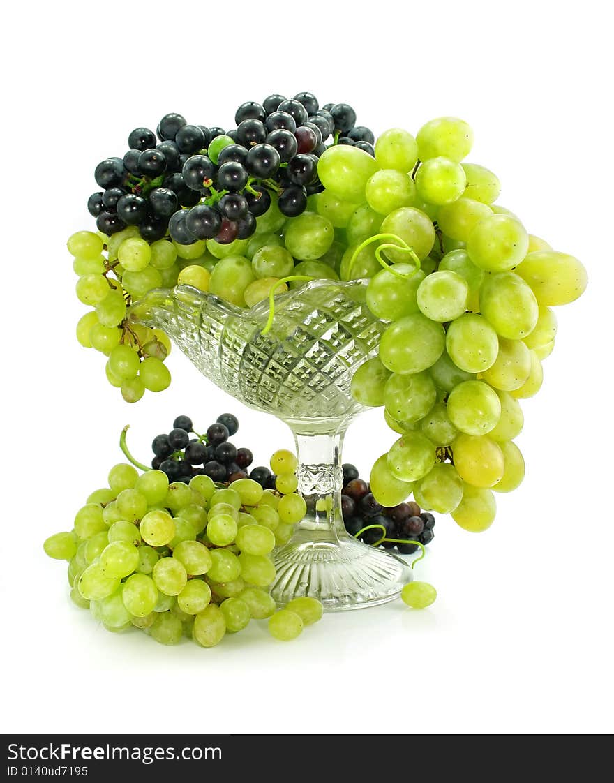 Cluster of green and blue grape isolated on white