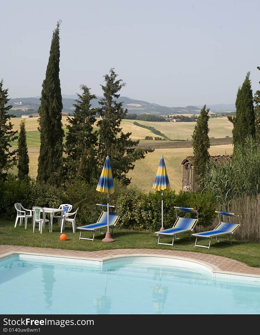 TUSCANY countryside with cypress and pool