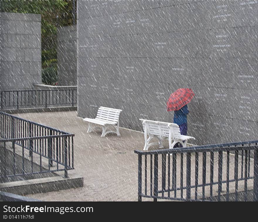 Person worshipping at above ground cemetery