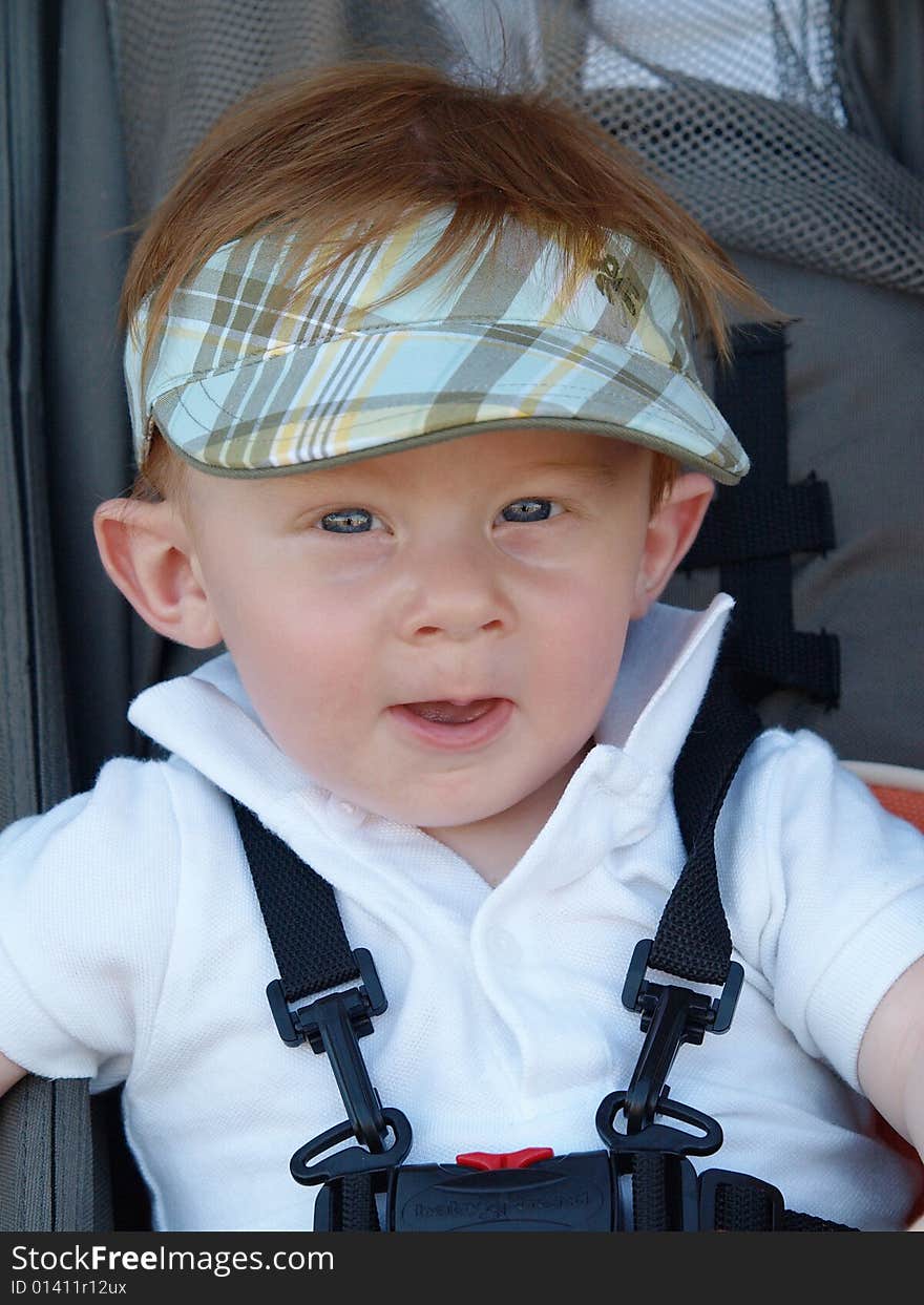 Photo of a baby boy in his stroller harness. Photo of a baby boy in his stroller harness