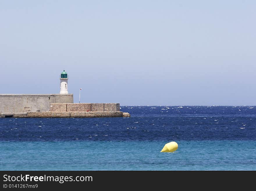 Light house on harbor entrance corsica