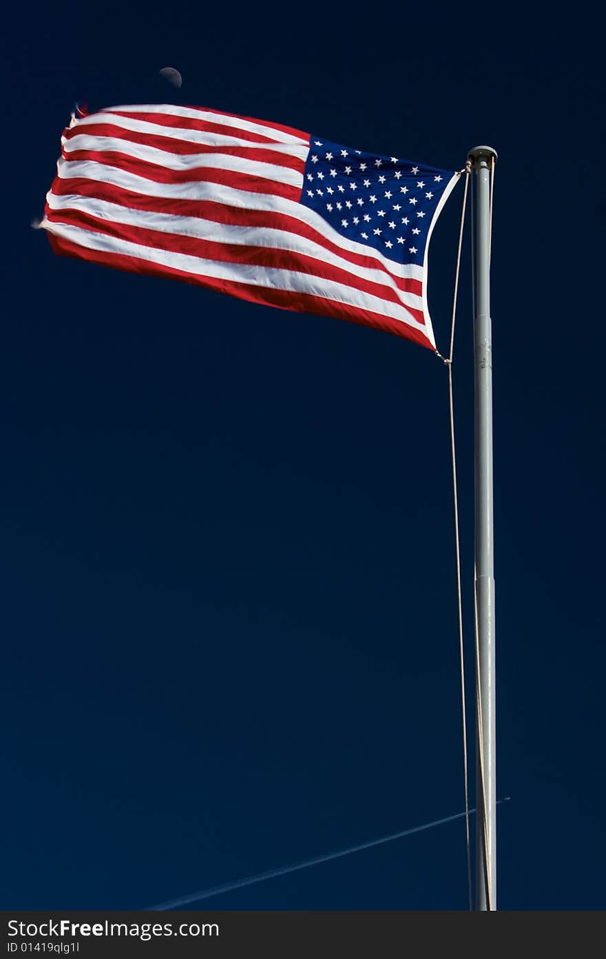 American flag with moon in the background