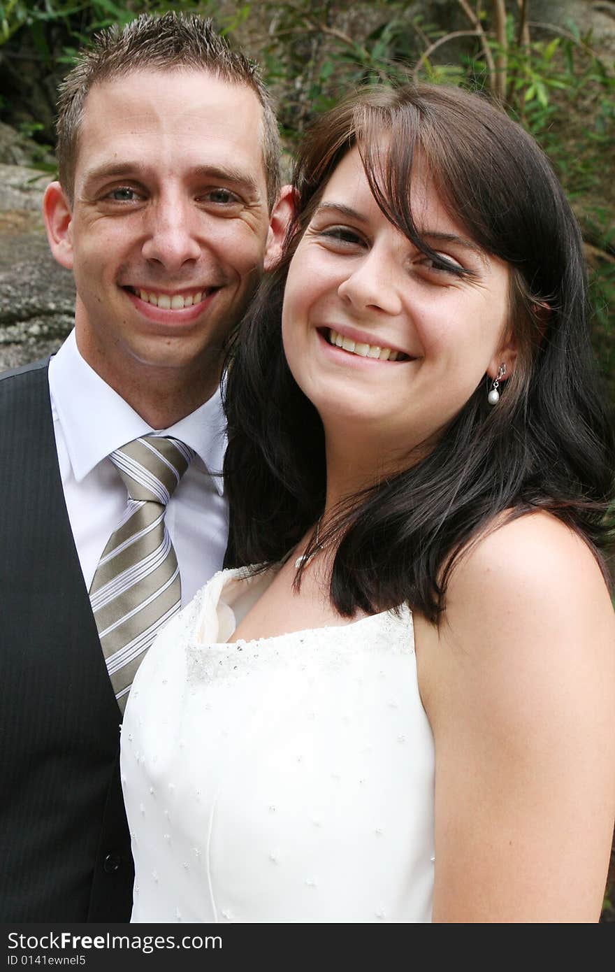 Happy young bride and groom on their wedding day.