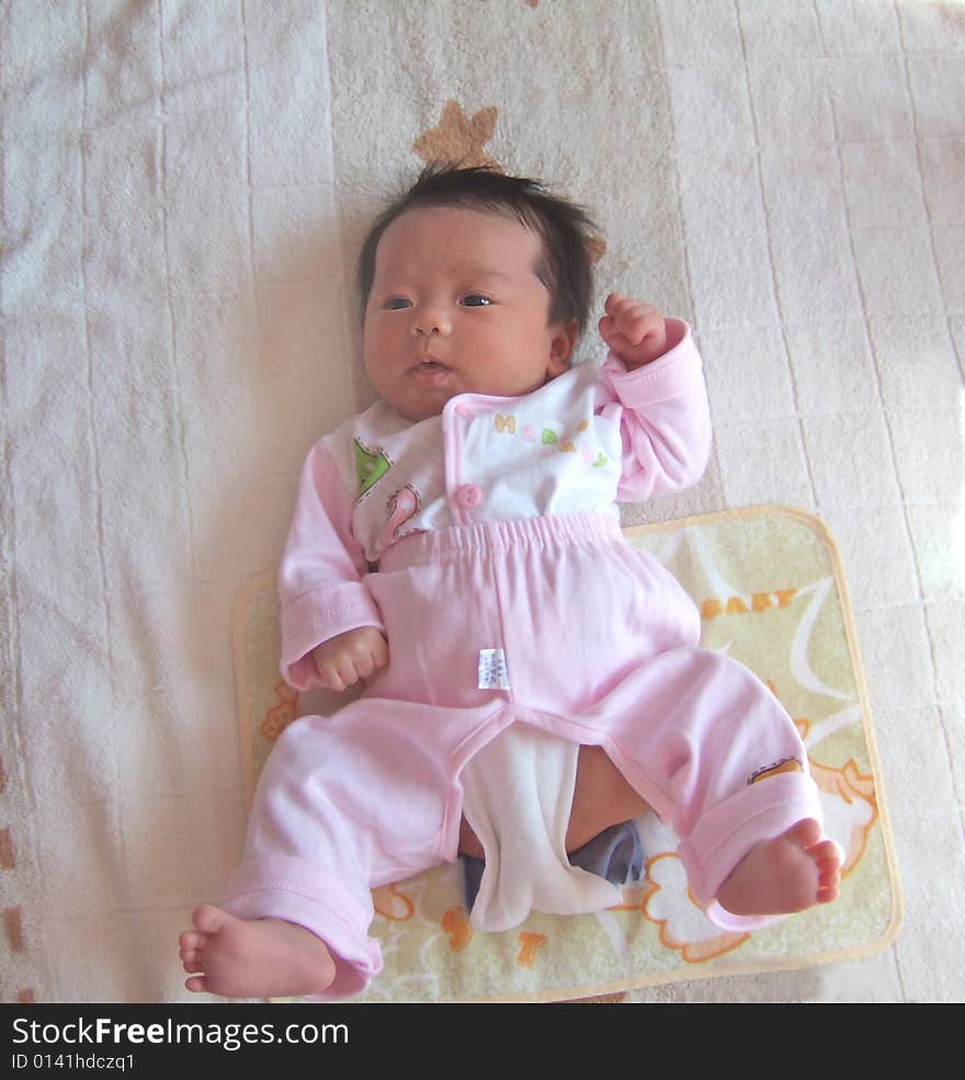 Adorable Baby on a bed