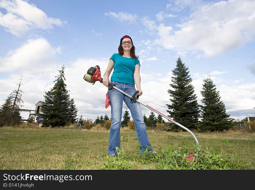 Woman with Weedwacker - Horizontal