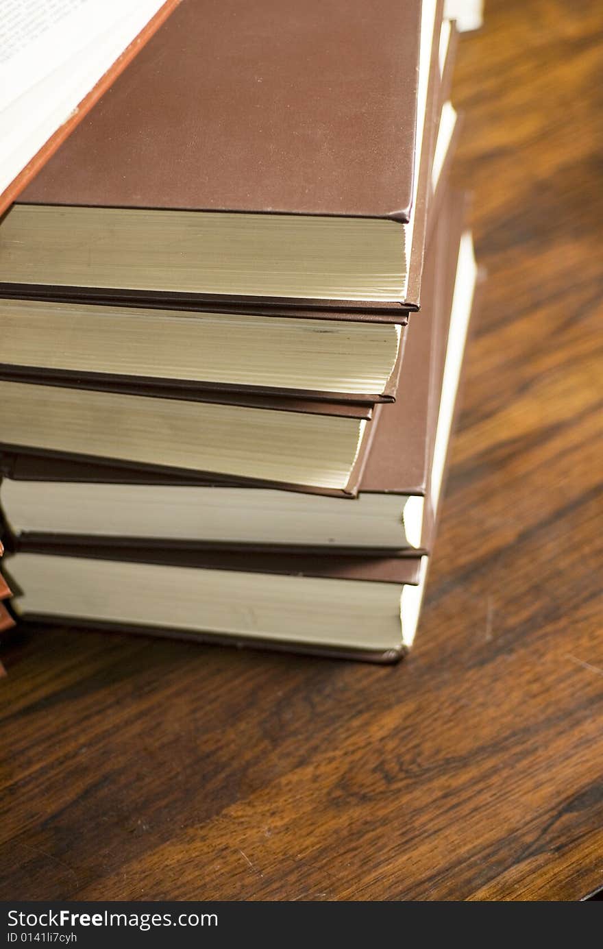 Books on a table. Vertically framed photo. Books on a table. Vertically framed photo.