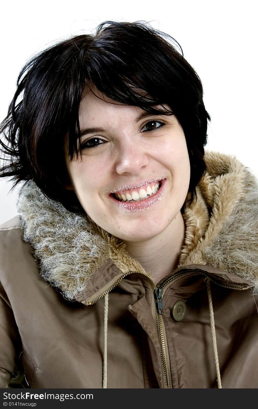 Beautiful young woman laughing on a white background