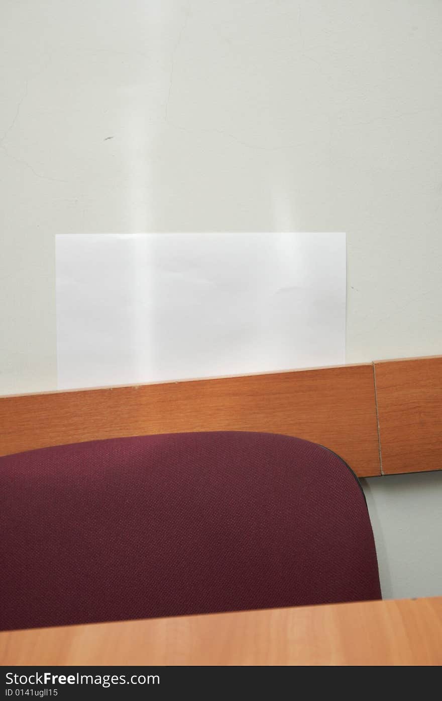 Red chair in classroom interior