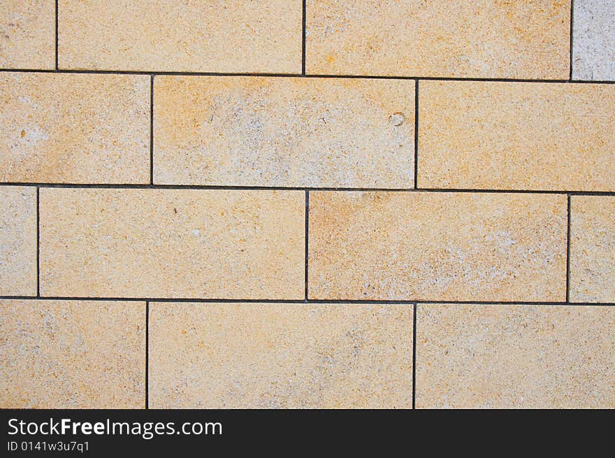 Yellow bricks stone texture can be used as background