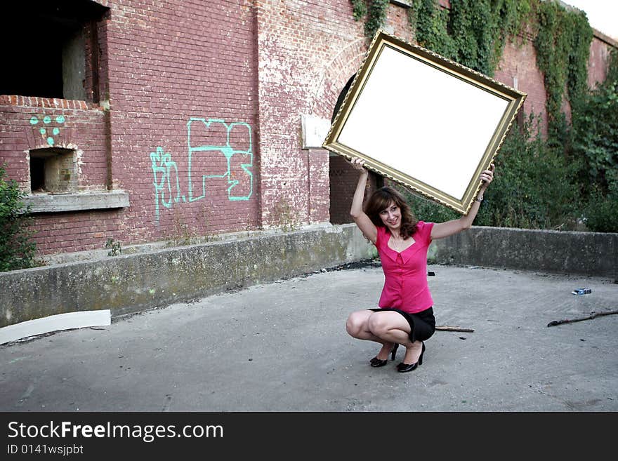 Girl holding a frame