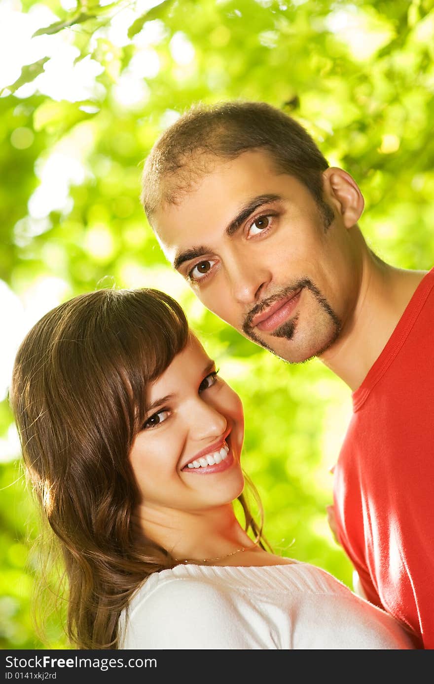 Young couple in love outdoors. Close-up portrait