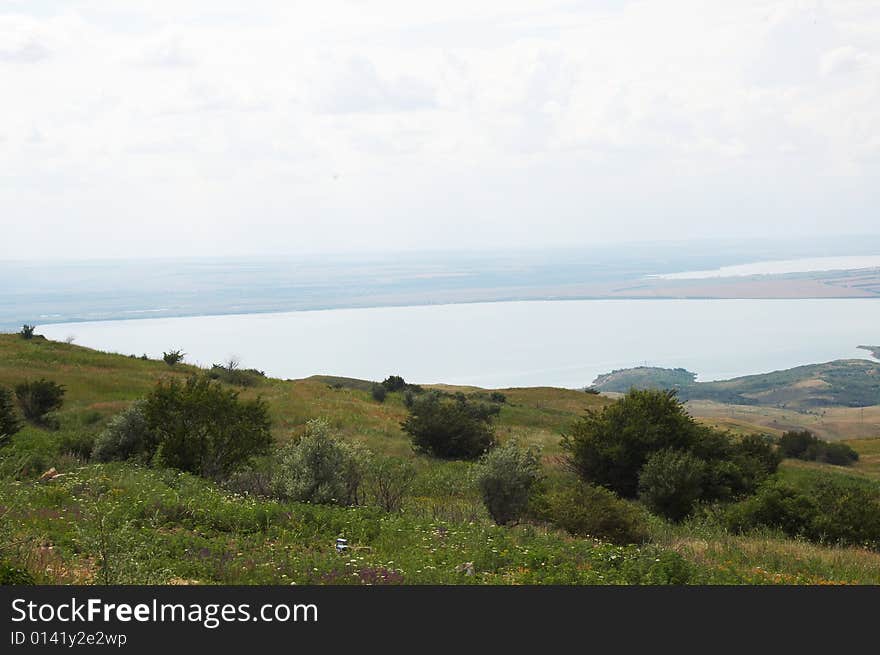 Summer beautiful landscape with lake and sky