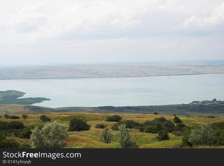 Summer beautiful landscape with lake and sky