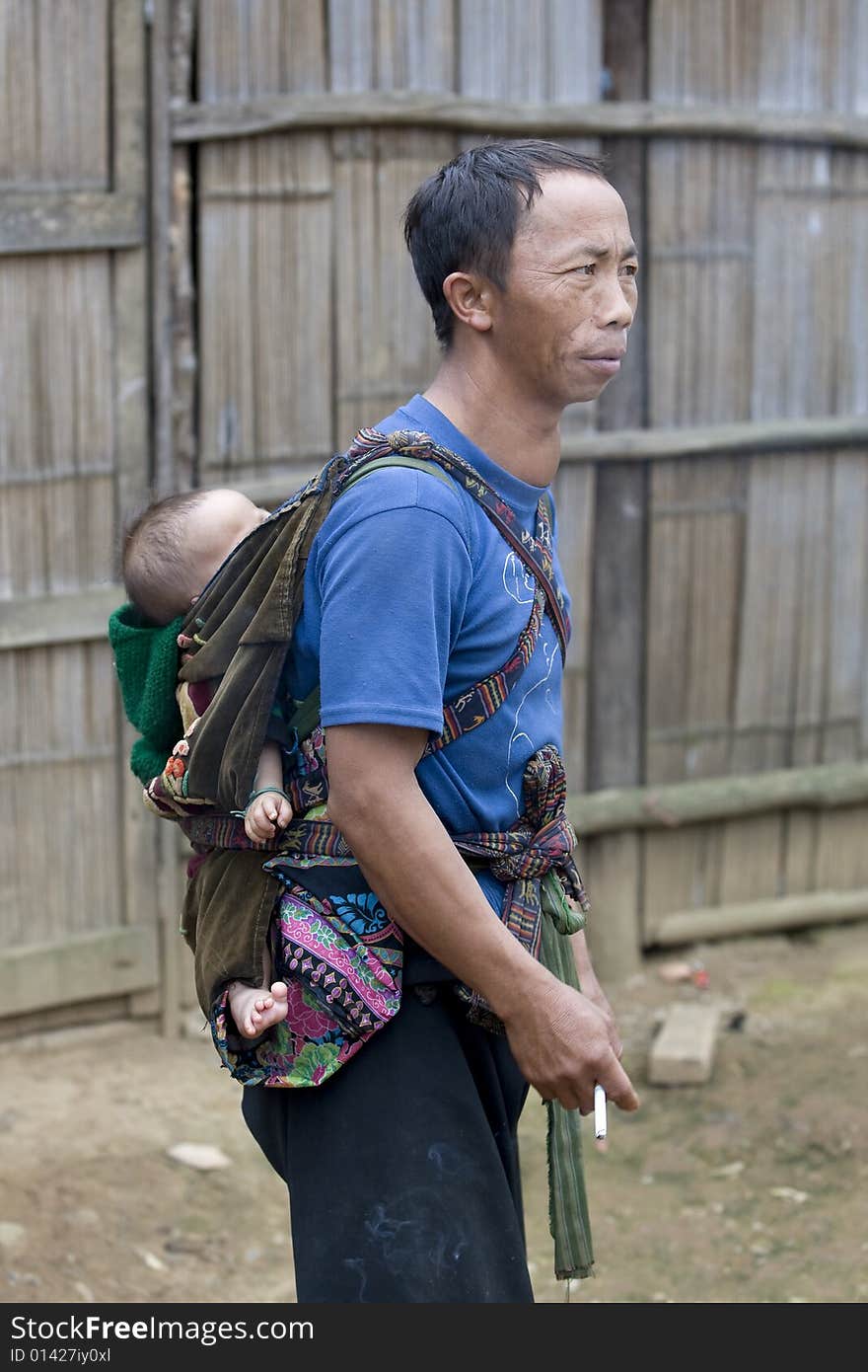 Father with baby in Laos