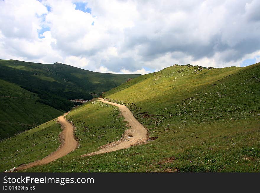 Mt. Wutaishan covers an area of 2,837 square kilometers (1,095.4 square miles), and its five main peaks, positioned east, south, west, north, and in the middle, embrace one another with broad and plain terraces rather than forests on their tops. That is why it bears the name Wutaishan (Mountain of Five Terraces). With the average altitude over 1,000 meters (over 3,281 feet), its apex, the summit of the northern peak which is famed as being the Roof of Northern China, reaches 3061.1 meters (10,043 feet). Besides the religious aspect, the beauty of rising and falling ridges of mountains, exotic rocks, crisscrossed gullies, crystalline waters and towering green forests also gives Mt. Wutaishan its reputation as a colorful and notable tourist resort. Mt. Wutaishan covers an area of 2,837 square kilometers (1,095.4 square miles), and its five main peaks, positioned east, south, west, north, and in the middle, embrace one another with broad and plain terraces rather than forests on their tops. That is why it bears the name Wutaishan (Mountain of Five Terraces). With the average altitude over 1,000 meters (over 3,281 feet), its apex, the summit of the northern peak which is famed as being the Roof of Northern China, reaches 3061.1 meters (10,043 feet). Besides the religious aspect, the beauty of rising and falling ridges of mountains, exotic rocks, crisscrossed gullies, crystalline waters and towering green forests also gives Mt. Wutaishan its reputation as a colorful and notable tourist resort.