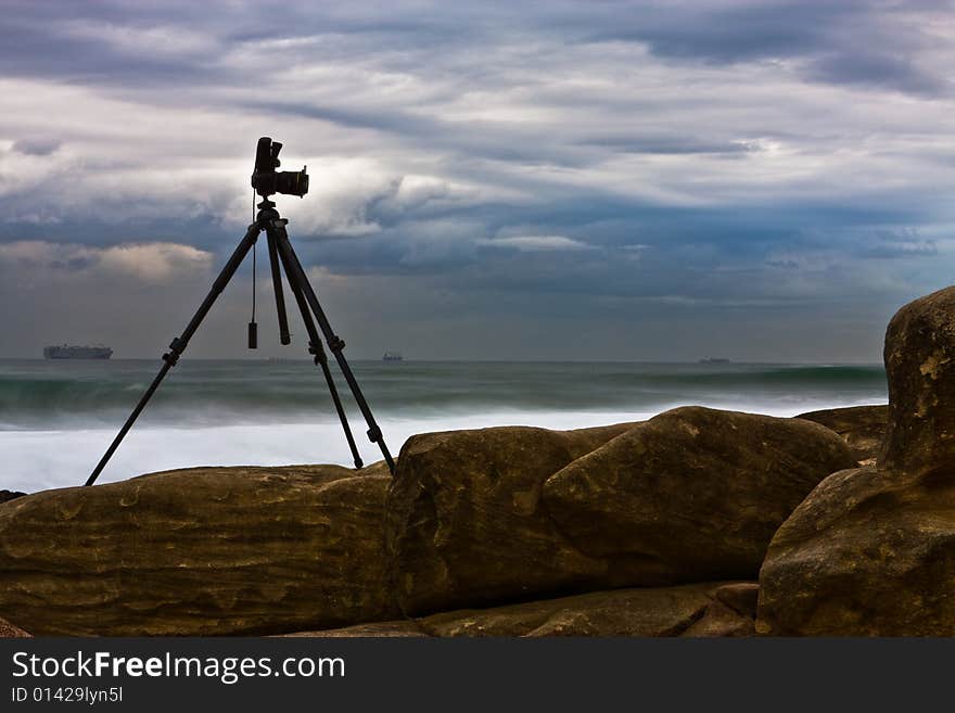 The hard working photographic equipment needed to capture rocks on the beach. The hard working photographic equipment needed to capture rocks on the beach