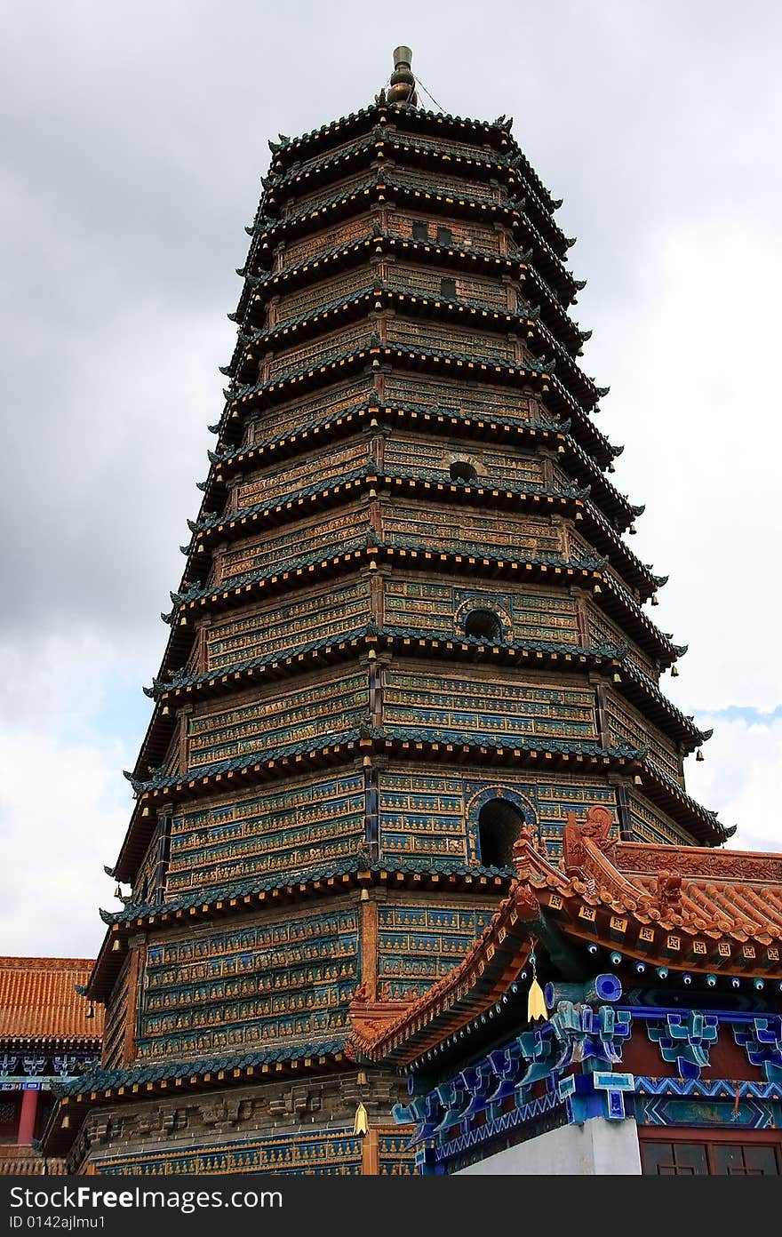 Tower with monk on wall