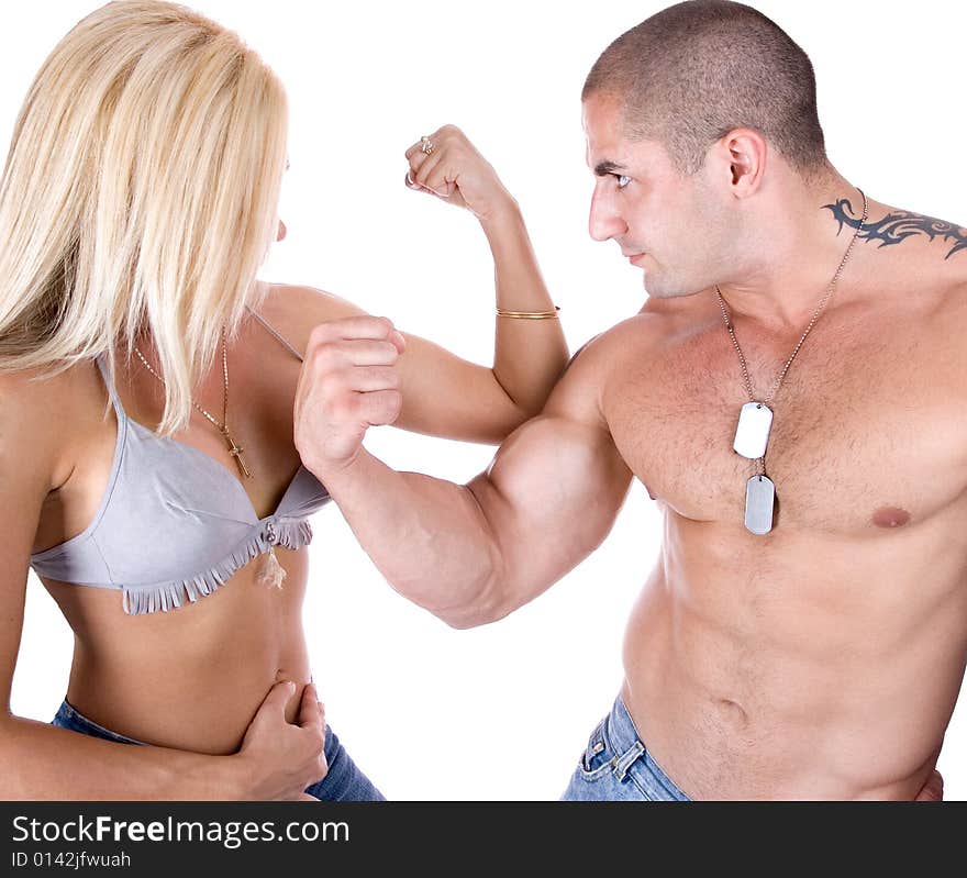 Man and woman showing who's biceps is stronger, isolated on background