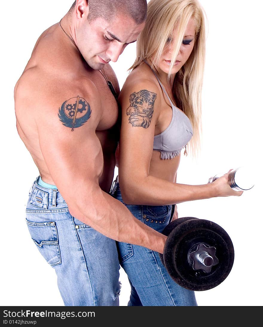 Young couple hang up hads weights ,isolated on white. Young couple hang up hads weights ,isolated on white