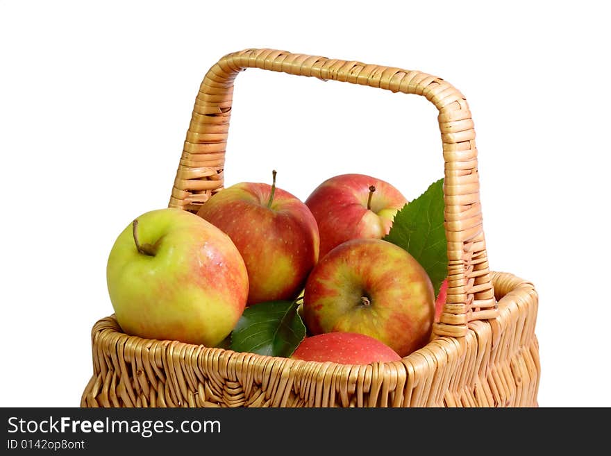 Basket with fresh apples on white background