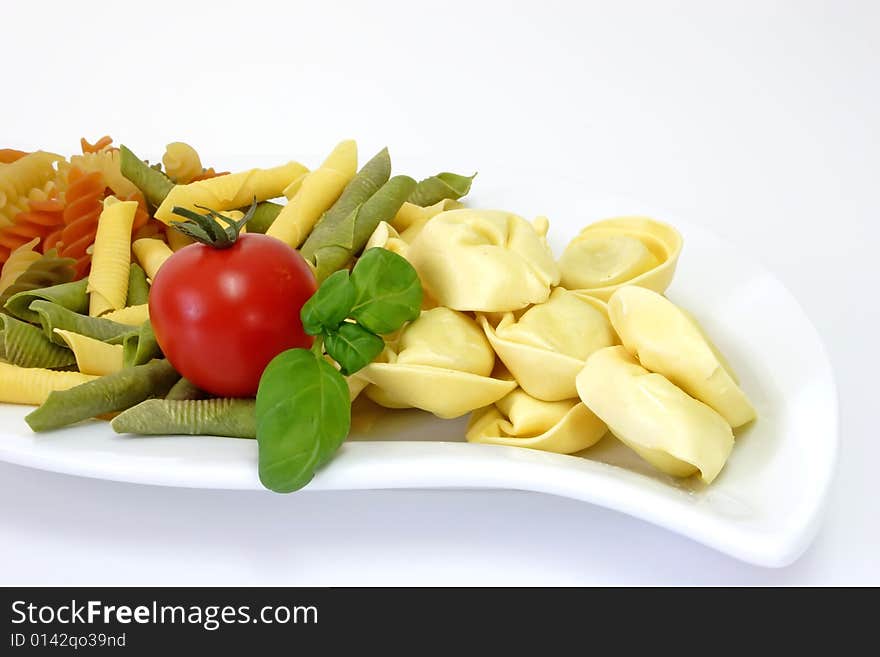 Raw pasta on bright background. Shot in Studio. Raw pasta on bright background. Shot in Studio.