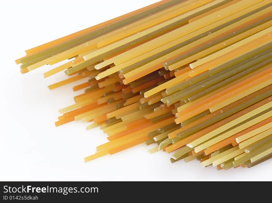 Raw pasta on bright background. Shot in Studio. Raw pasta on bright background. Shot in Studio.