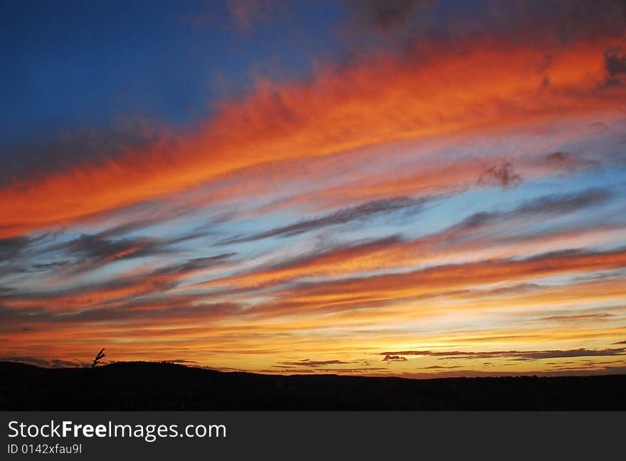 A beautiful vivid sunset in Stuttgart with milky sky