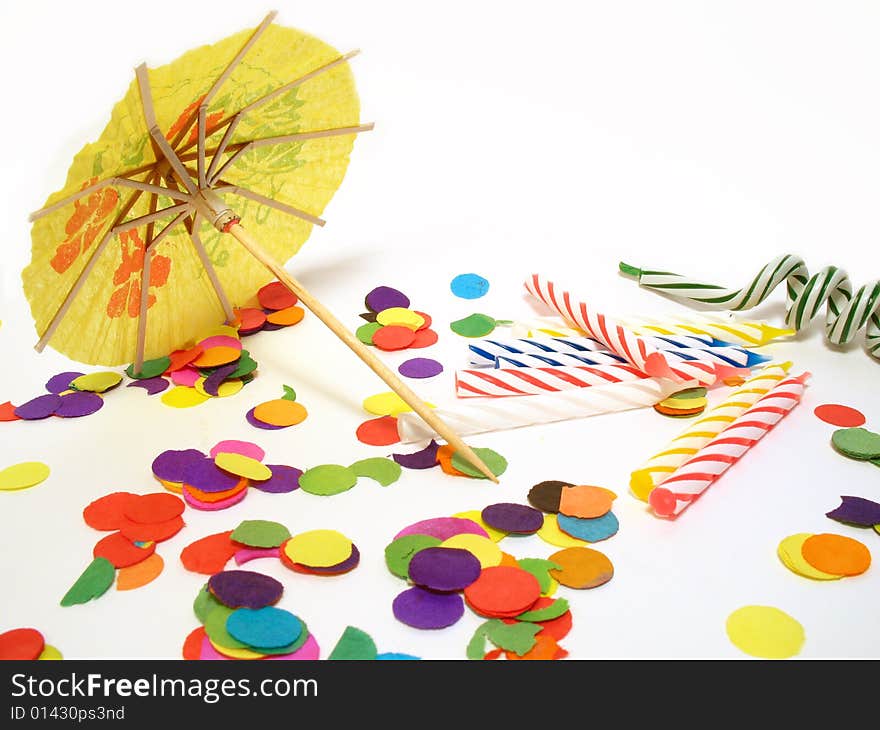 Detail of party still life, confetti, candles and umbrella. Detail of party still life, confetti, candles and umbrella