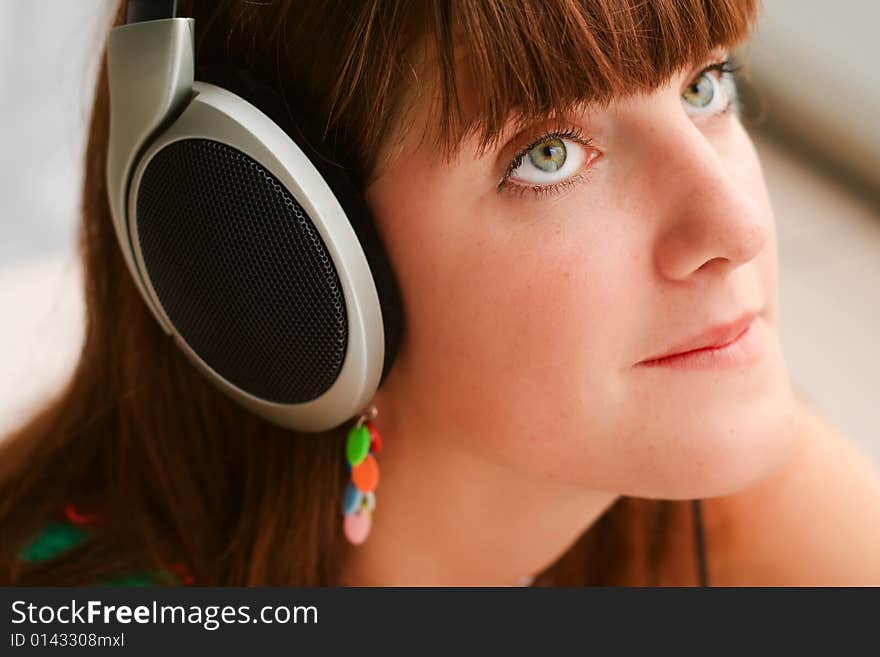 Pretty girl with big headphones portrait. Pretty girl with big headphones portrait