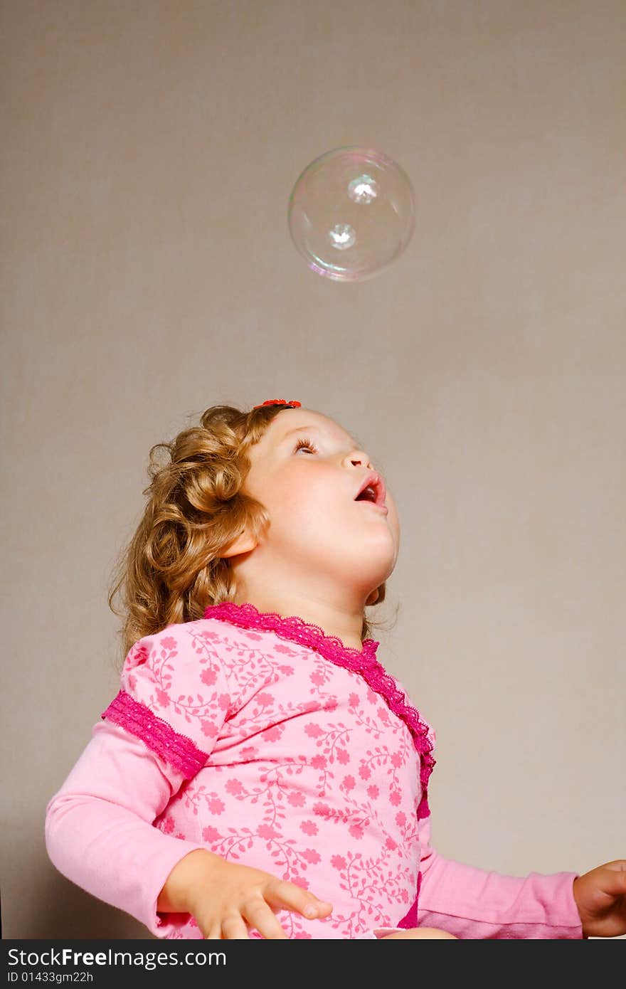 Small pretty girl with soap bubble. Small pretty girl with soap bubble