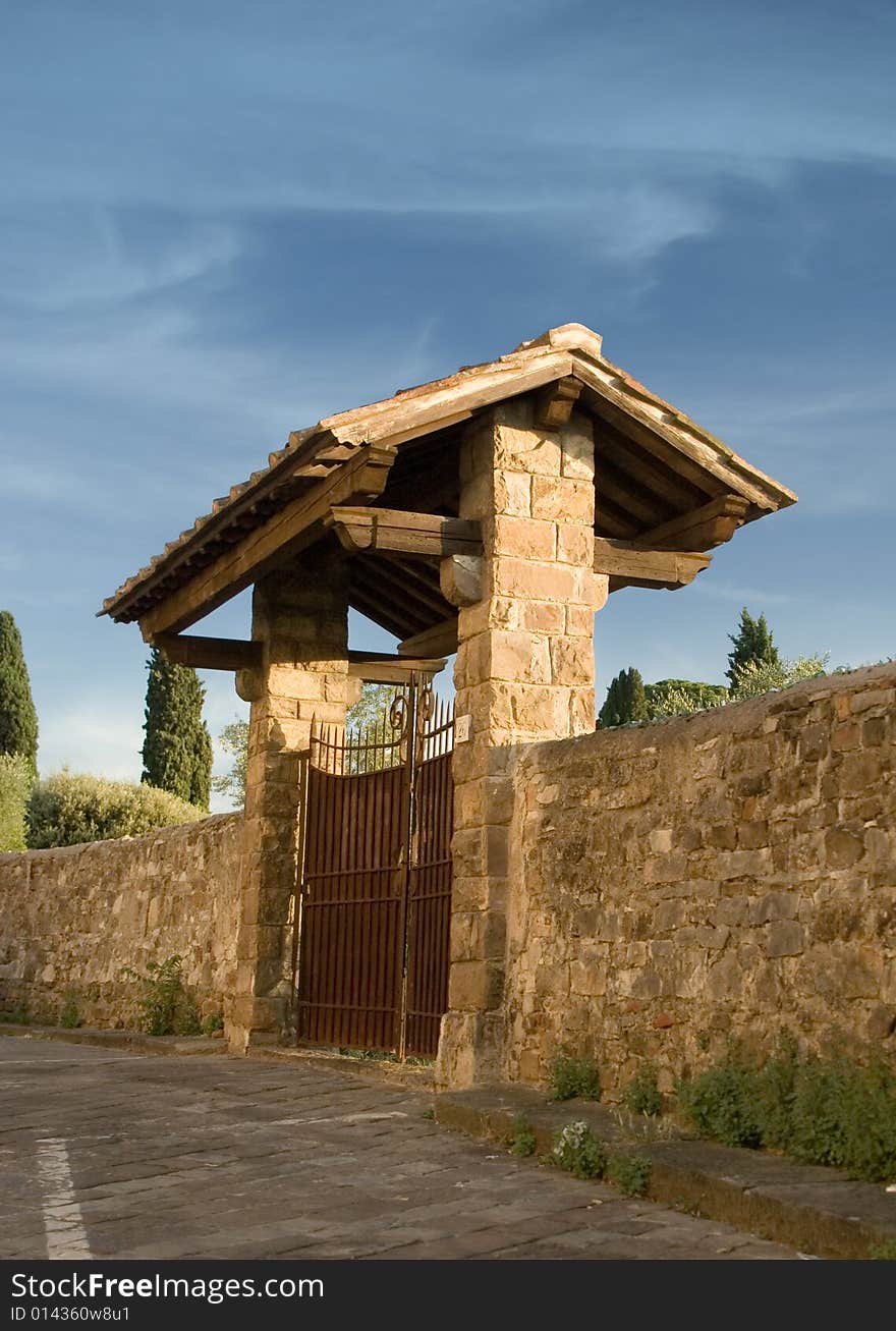 Closeup of old Italian fence with stone gates. Closeup of old Italian fence with stone gates