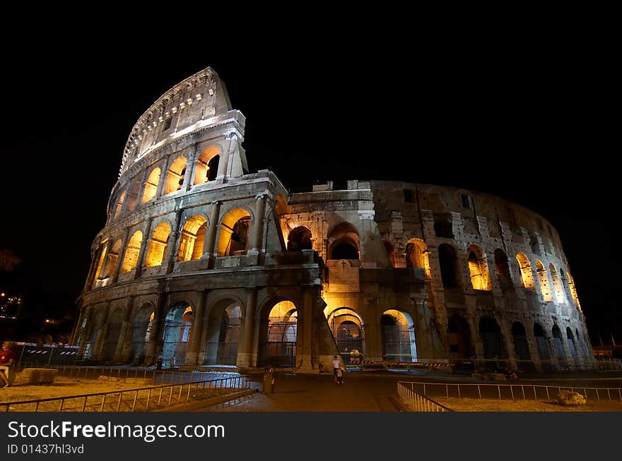 The Colosseum (Latin: Amphitheatrum Flavium) at night. Rome, Italy. The Colosseum (Latin: Amphitheatrum Flavium) at night. Rome, Italy.