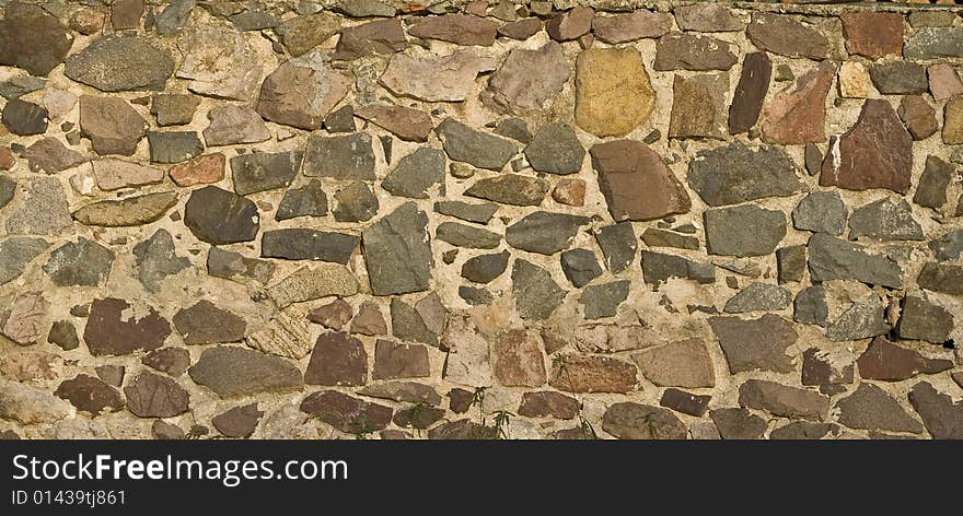 Stone wall background with ancient appearance